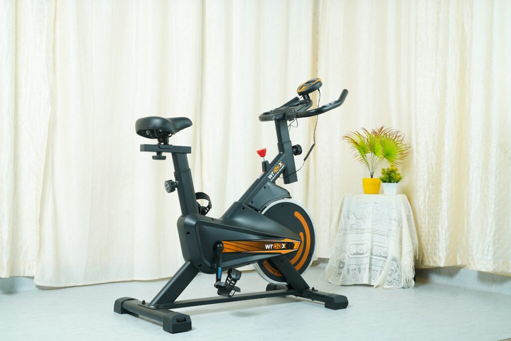 Upright exercise bike for home with display and pedals