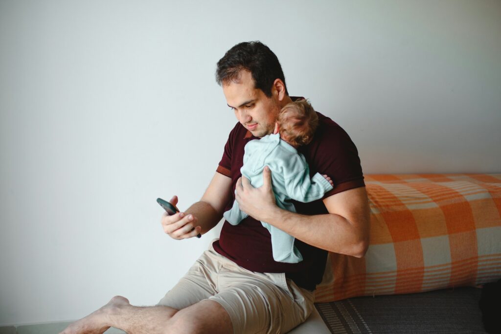 Relaxed parent using baby monitor